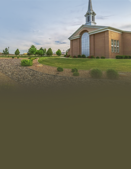 Church with steeple and landscaped garden