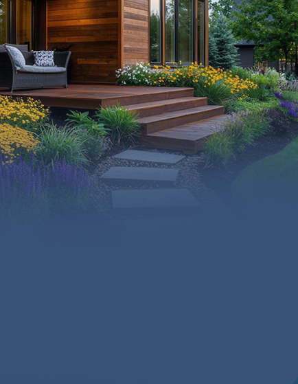 Wooden deck surrounded by colorful garden flowers.